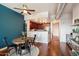 Open-concept living area featuring a kitchen with dark wood cabinets, hardwood floors, and a cozy dining nook at 310 S 4Th St # 908, Phoenix, AZ 85004