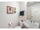 Convenient powder room features a modern vanity, toilet, and decorative accents at 310 S 4Th St # 908, Phoenix, AZ 85004