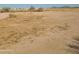 Large empty lot with sparse vegetation at 32297 W Trading Post Rd, Maricopa, AZ 85138