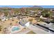 Aerial view showing home, pool, and mountain views in the background at 3312 E Flower St, Phoenix, AZ 85018