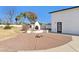 Backyard with fire pit and kiva-style fireplace at 3312 E Flower St, Phoenix, AZ 85018