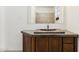 Bathroom with wood vanity, stone countertop, and shower at 3312 E Flower St, Phoenix, AZ 85018