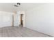 Spacious bedroom with tile floors and built-in shelving at 3312 E Flower St, Phoenix, AZ 85018