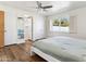 Spacious bedroom with wood floors and access to bathroom at 3312 E Flower St, Phoenix, AZ 85018