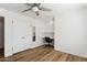 Bedroom with built-in workspace and mirrored closet doors at 3312 E Flower St, Phoenix, AZ 85018