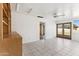 Bright bonus room with tile floors and French doors at 3312 E Flower St, Phoenix, AZ 85018