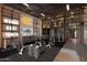 Modern gym with extensive equipment, motivational signage, and dedicated workout space for fitness enthusiasts at 3312 E Flower St, Phoenix, AZ 85018