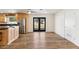 Kitchen with wood cabinets, stainless steel appliances, and vinyl flooring at 3312 E Flower St, Phoenix, AZ 85018