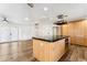 Open kitchen features a large island and updated cabinetry at 3312 E Flower St, Phoenix, AZ 85018