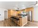 Spacious kitchen with granite countertops, island, and stainless steel appliances at 3312 E Flower St, Phoenix, AZ 85018