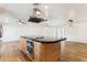 Island kitchen with granite countertop and stainless steel appliances at 3312 E Flower St, Phoenix, AZ 85018