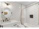 Modern bathroom with white subway tile, white vanity, and oval mirror at 3446 N 14Th Pl, Phoenix, AZ 85014