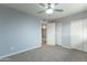 Bedroom with carpet flooring, and double door closet at 3515 W St Moritz Ln, Phoenix, AZ 85053