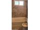 Updated bathroom with new tile and a modern bathtub at 3702 W Mulberry Dr, Phoenix, AZ 85019