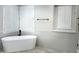 Elegant bathroom with soaking tub and modern fixtures at 3957 E Expedition Way, Phoenix, AZ 85050