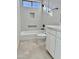 Clean bathroom, bathtub shower combo, and white cabinets at 3957 E Expedition Way, Phoenix, AZ 85050