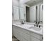 Double vanity bathroom with white cabinets and quartz countertop at 3957 E Expedition Way, Phoenix, AZ 85050