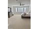 Bright bedroom with plush carpeting and large windows at 3957 E Expedition Way, Phoenix, AZ 85050