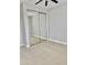 Spacious bedroom with mirrored closet doors and carpet at 3957 E Expedition Way, Phoenix, AZ 85050