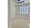 Bright bedroom with carpeted floor and ceiling fan at 3957 E Expedition Way, Phoenix, AZ 85050