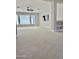 Spacious bonus room with large windows and ceiling fan at 3957 E Expedition Way, Phoenix, AZ 85050