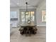 Kitchen features a farmhouse dining table with bench seating at 3957 E Expedition Way, Phoenix, AZ 85050