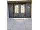 Elegant double front doors with ornate iron detailing at 3957 E Expedition Way, Phoenix, AZ 85050