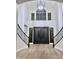 Two-story entryway with grand staircase and chandelier at 3957 E Expedition Way, Phoenix, AZ 85050