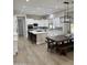Modern kitchen with white cabinets, large island, and breakfast nook at 3957 E Expedition Way, Phoenix, AZ 85050