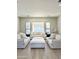 Spacious living room with large windows and comfy seating at 3957 E Expedition Way, Phoenix, AZ 85050