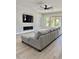 Spacious living room with fireplace and large sectional sofa at 3957 E Expedition Way, Phoenix, AZ 85050