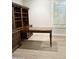 Home office with built-in wooden desk and shelving at 3957 E Expedition Way, Phoenix, AZ 85050