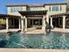 Luxury backyard oasis with a large pool and pergola at 3957 E Expedition Way, Phoenix, AZ 85050