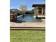 Inviting pool area with stone accents and water features at 3957 E Expedition Way, Phoenix, AZ 85050