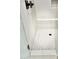 Walk in shower with hexagonal tile floor and built in seat at 3957 E Expedition Way, Phoenix, AZ 85050