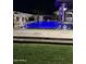Night view of the pool, with blue lighting and water features at 3957 E Expedition Way, Phoenix, AZ 85050