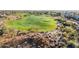 Aerial view of a golf course surrounded by homes at 41007 N Harbour Town Way, Anthem, AZ 85086