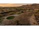 Aerial view of a luxury community with mountain views and golf course at 41007 N Harbour Town Way, Anthem, AZ 85086