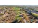 Aerial view of a golf course community with mountains in the background at 41007 N Harbour Town Way, Anthem, AZ 85086