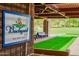 Backyard features a bocce ball court, seating area, and signage at 41007 N Harbour Town Way, Anthem, AZ 85086