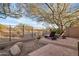 Landscaped backyard with lounge chairs and desert landscape view at 41007 N Harbour Town Way, Anthem, AZ 85086