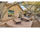 Circular patio with lounge chairs and view of pool and desert landscape at 41007 N Harbour Town Way, Anthem, AZ 85086