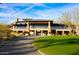 Elegant clubhouse exterior showcasing a well-maintained lawn and inviting entrance at 41007 N Harbour Town Way, Anthem, AZ 85086