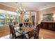 Elegant dining room featuring a large table and hardwood floors at 41007 N Harbour Town Way, Anthem, AZ 85086