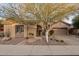 Single-story home with attractive landscaping and a two-car garage at 41007 N Harbour Town Way, Anthem, AZ 85086
