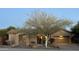 Single-story home with desert landscaping and two-car garage at 41007 N Harbour Town Way, Anthem, AZ 85086