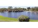 Serene lake with waterfall feature and playground views at 41007 N Harbour Town Way, Anthem, AZ 85086