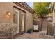 Private patio with comfortable seating and a tranquil water feature at 41007 N Harbour Town Way, Anthem, AZ 85086