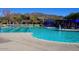 Community pool featuring lap lanes, lounge chairs, cabanas, and mountain views at 41007 N Harbour Town Way, Anthem, AZ 85086