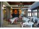 Upscale restaurant featuring elegant decor, a fireplace, and tables with place settings at 41007 N Harbour Town Way, Anthem, AZ 85086